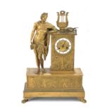 A 19th century French Empire period gilt bronze mantel clock