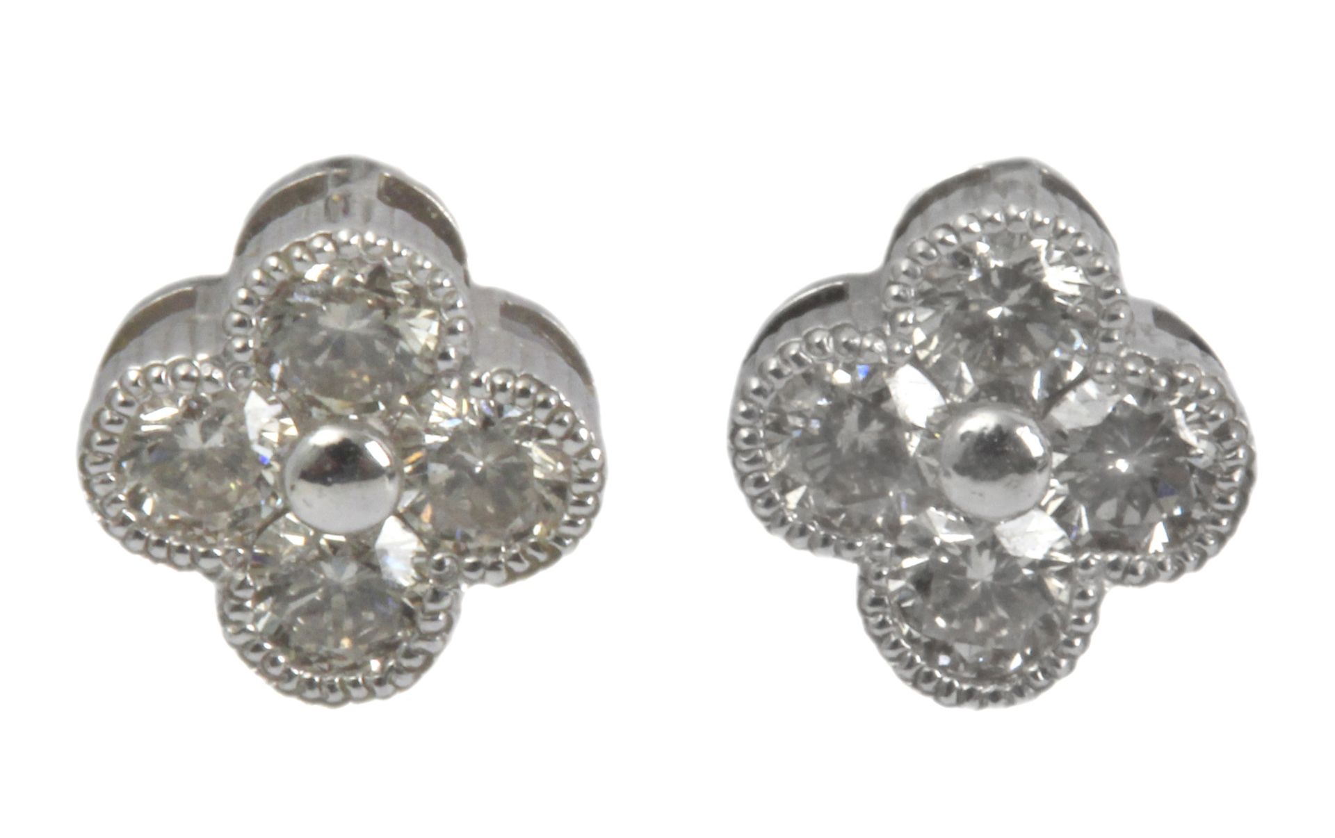 A pair of Alhambra style earrings with an 18 k. white gold setting and round brilliant cut diamonds