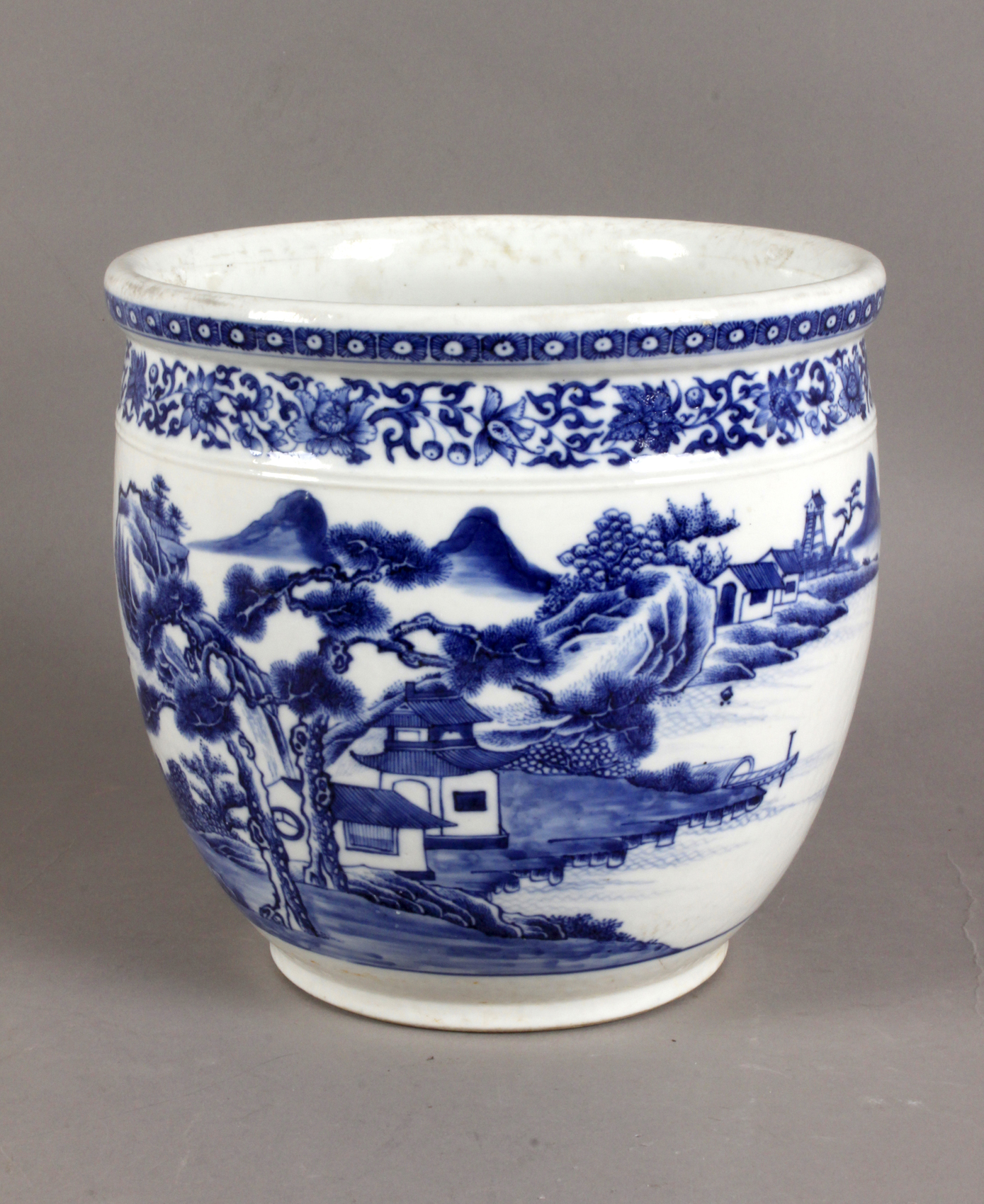 A late 18th century Chinese prob. Kangxi cache-pot in white and blue porcelain