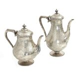 A pair of 19th century English silver teapots