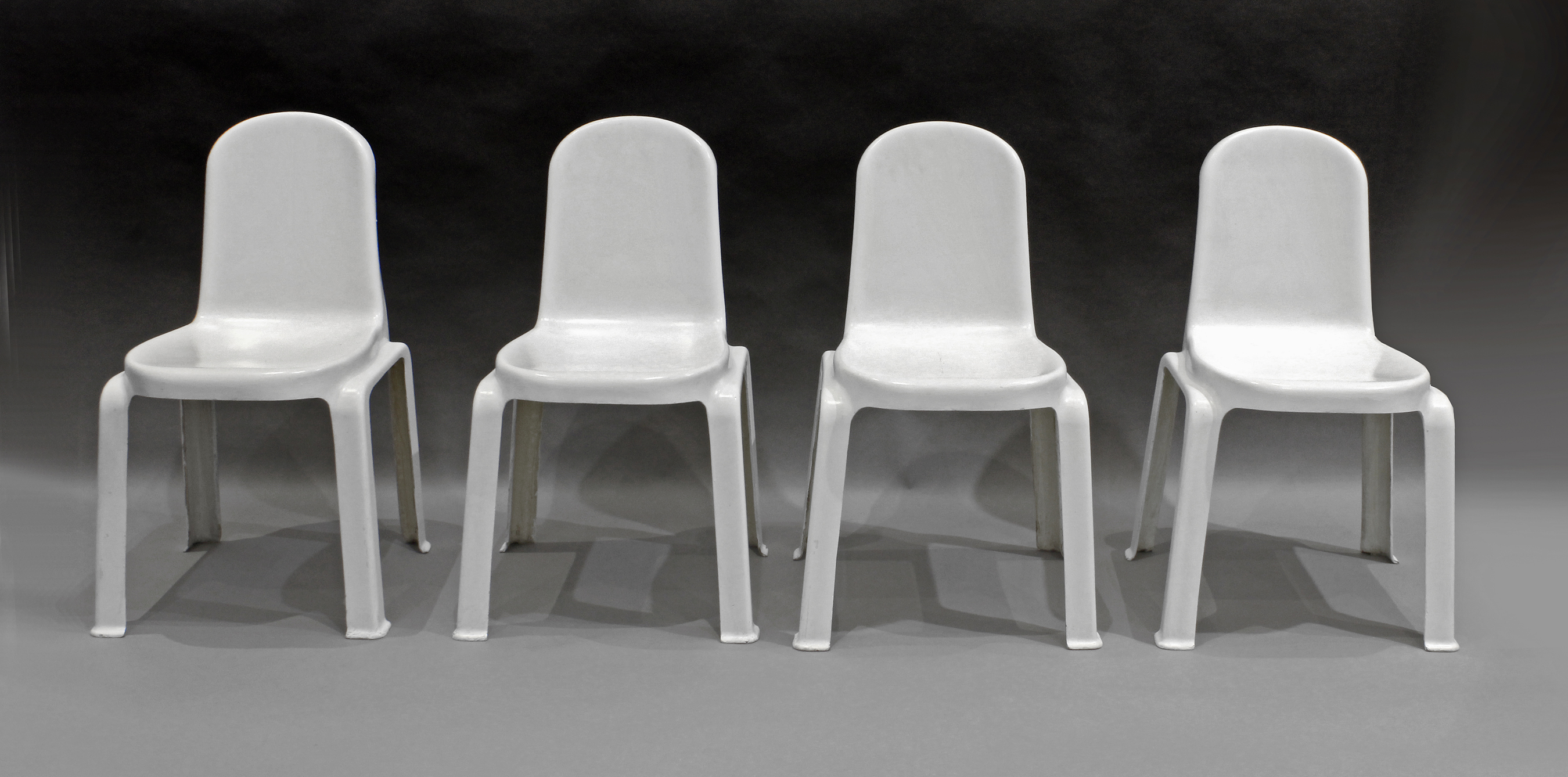 Set of four Space Age stackable fibreglass chairs circa 1960