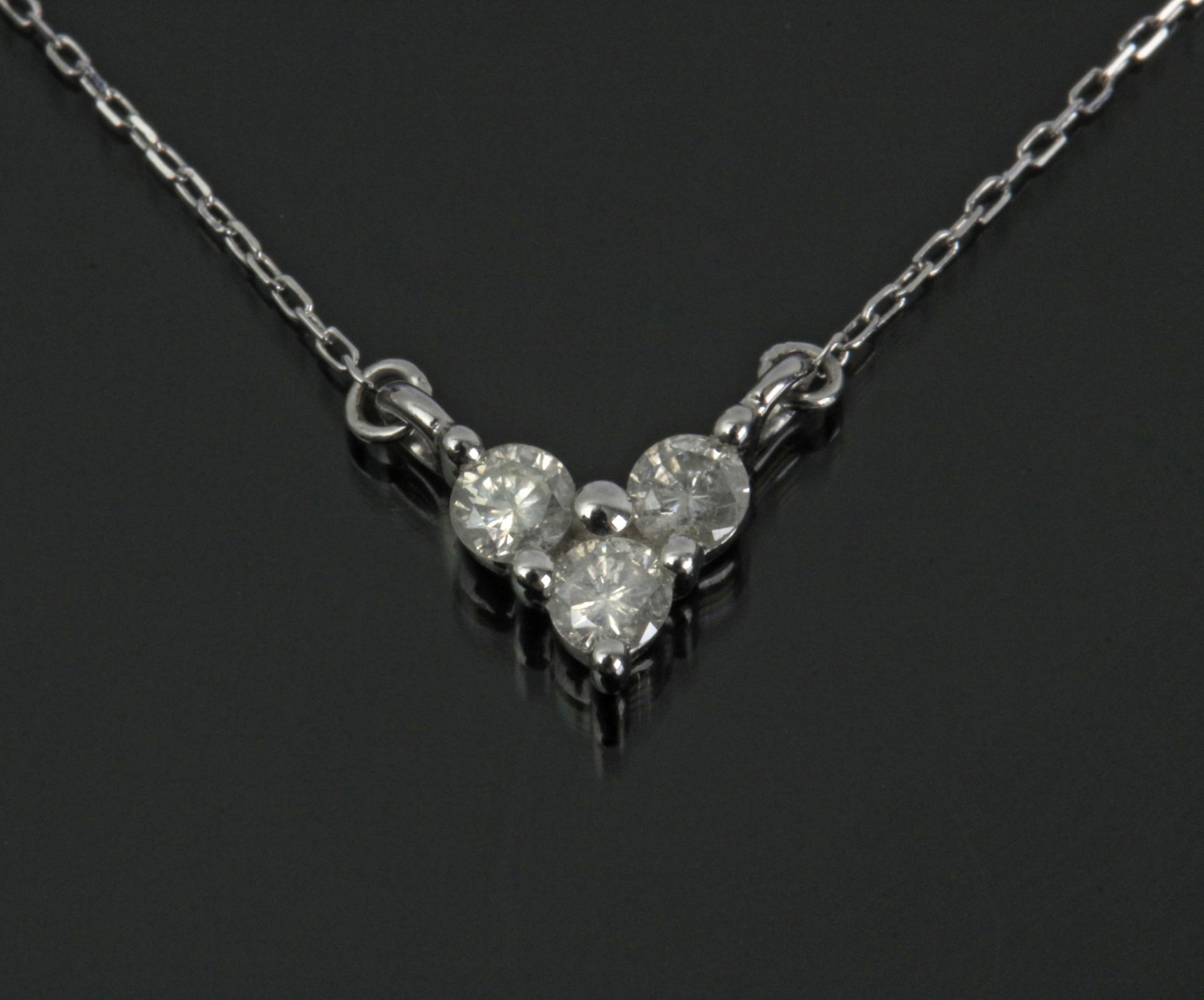 A diamonds heart shaped pendant with an 18 k. white gold setting