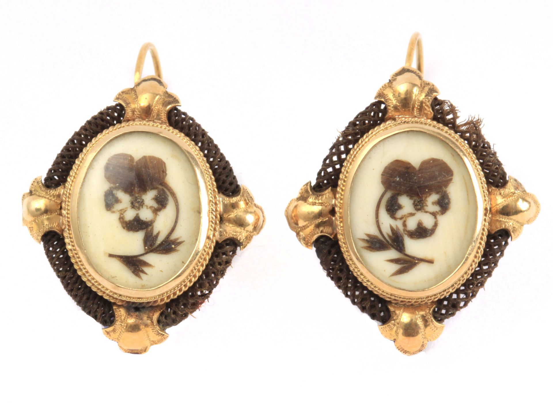 A pair of 19th century mourning earrings with a yellow gold setting, an ivory plaque and hairwork