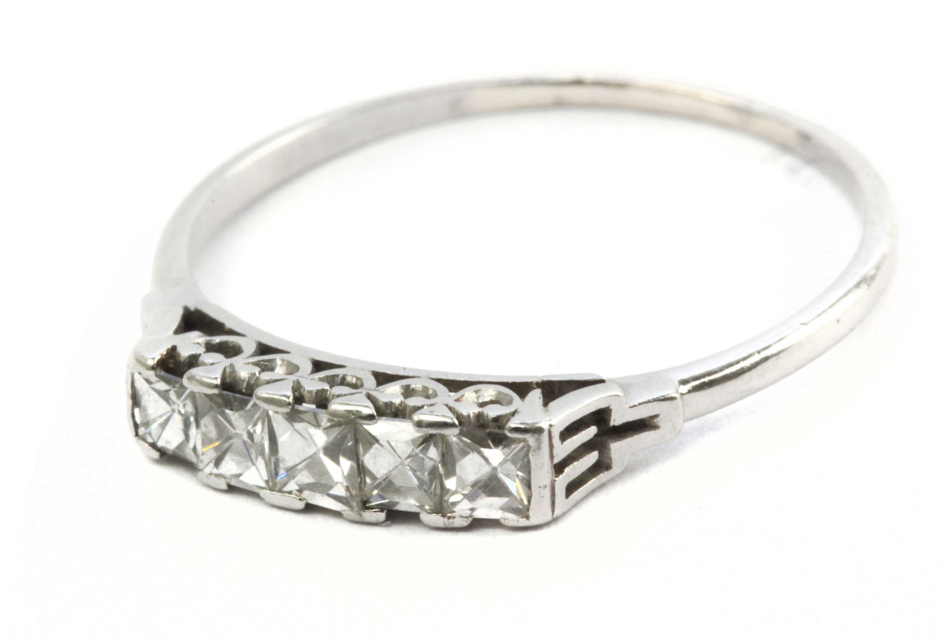 An early 20th century five stone ring with a platinum setting and French cut diamonds