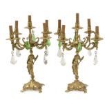 A pair of first half of 20th century gilt bronze and glass five light candelabras
