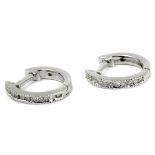 A pair of hoop earrings with an 18 k. white gold setting and round brilliant cut diamonds