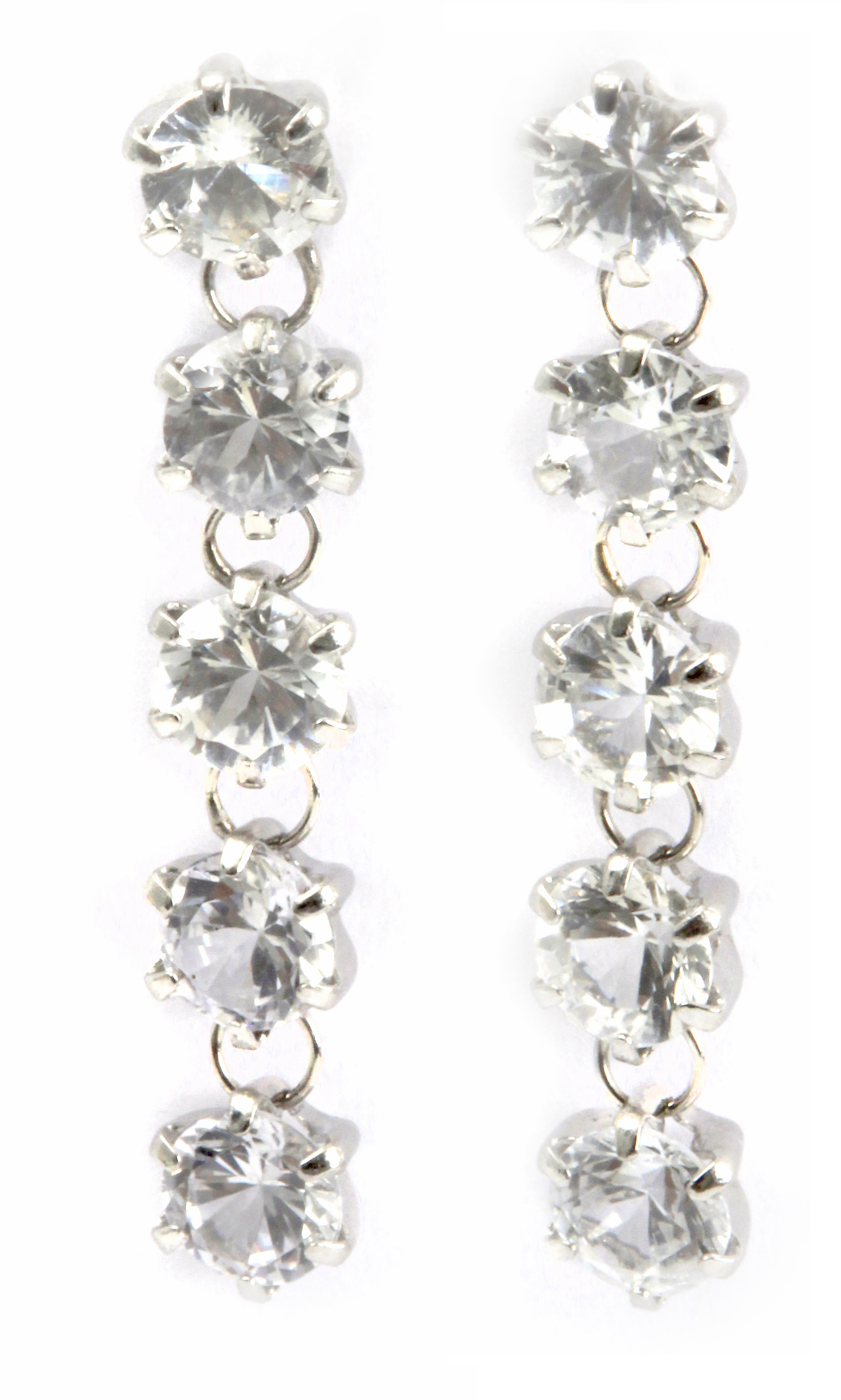 A pair of long earrings with a platinum setting and colourless sapphires