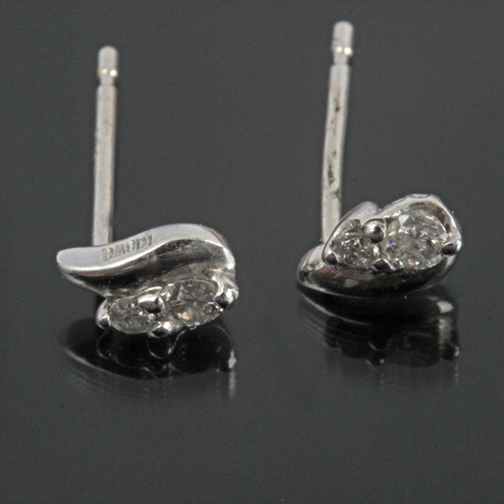 A round brilliant cut diamond stud earrings with an 18k. white gold setting