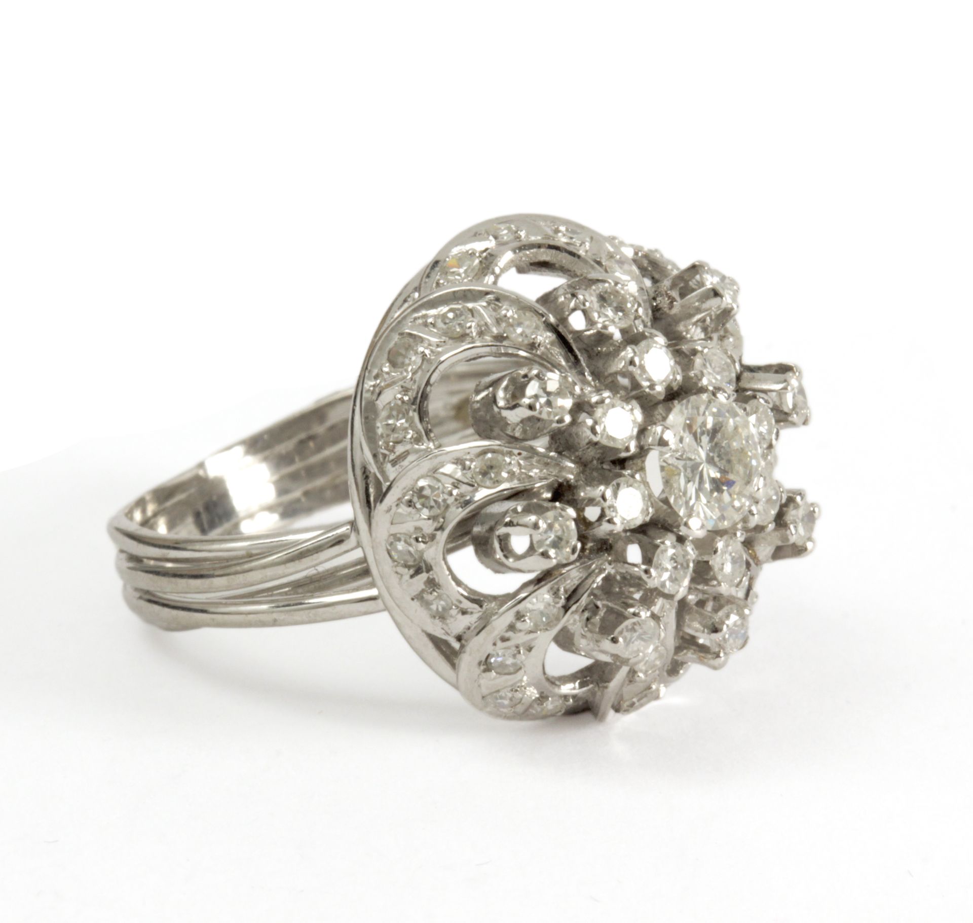 A brilliant cut diamonds bombe ring circa 1950 with a platinum setting - Image 2 of 3