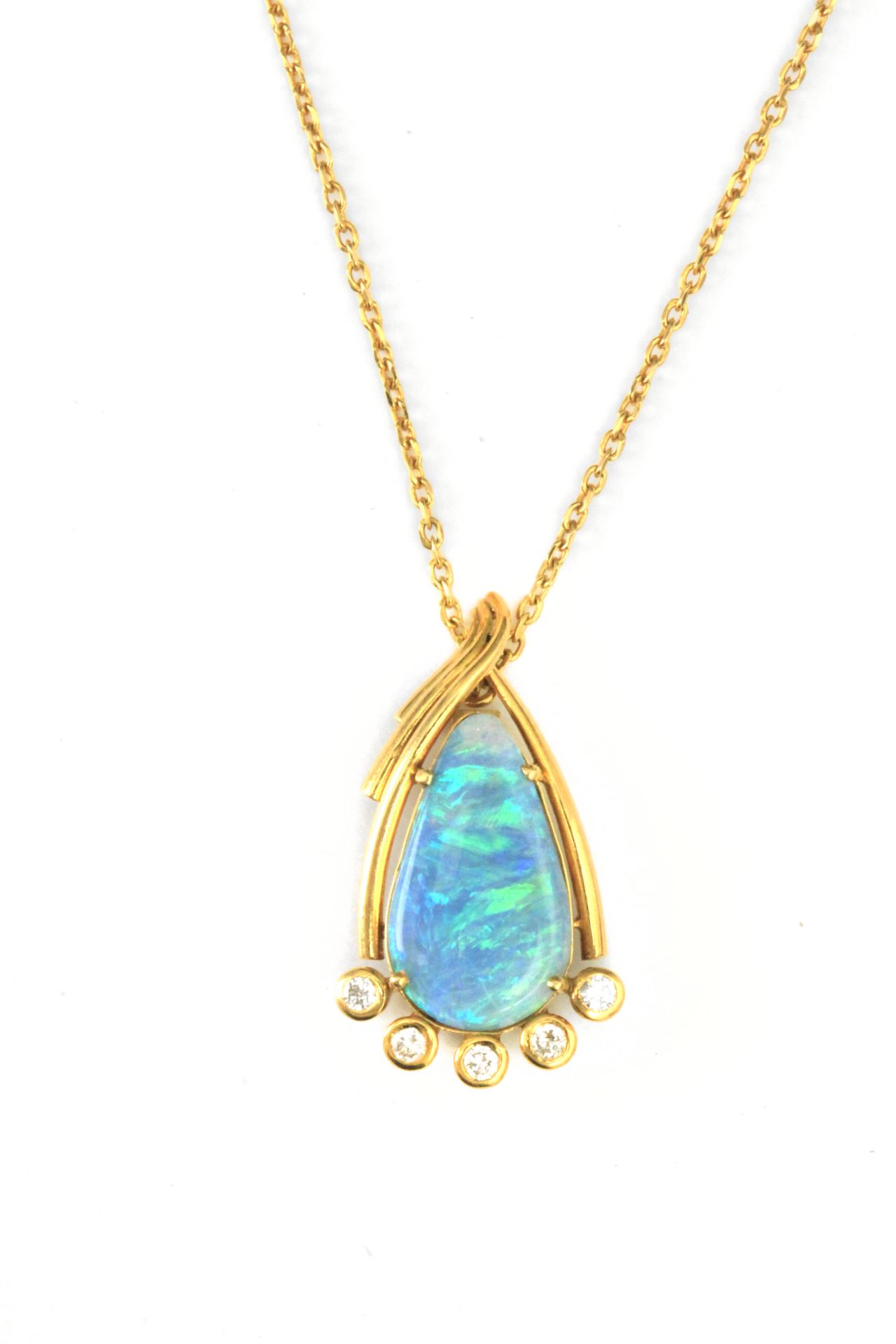 A black opal and diamond pendant with an 18 k. yellow gold setting and chain