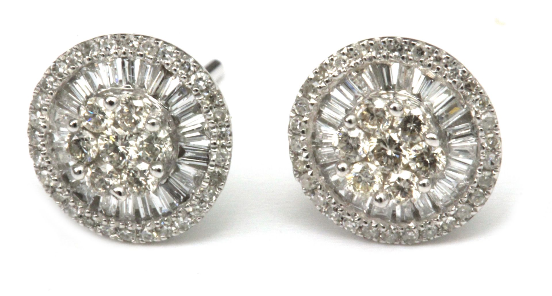 A pair of diamond cluster earrings with an 18 k. white gold setting