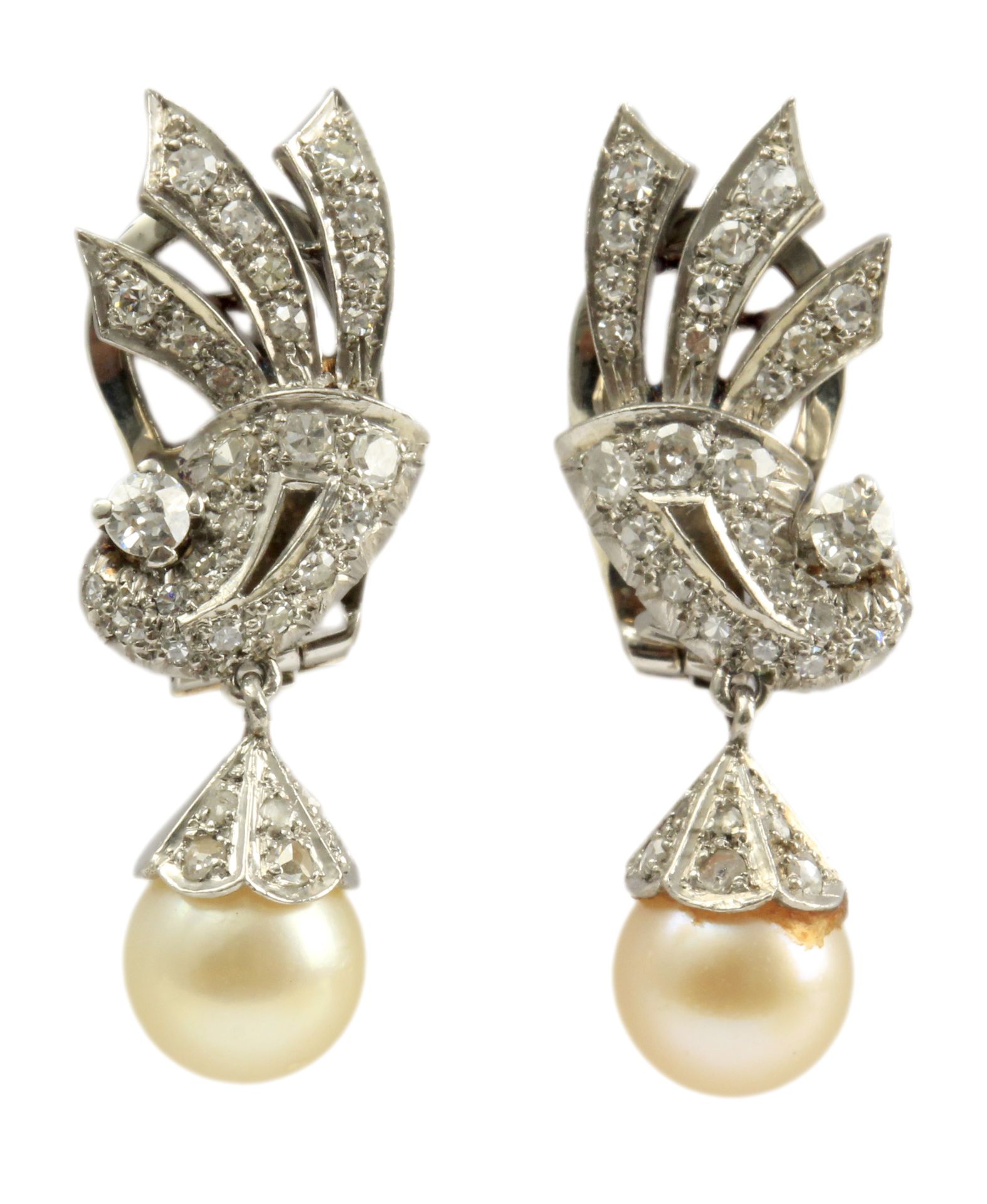 A pair of diamond earrings with a platinum setting