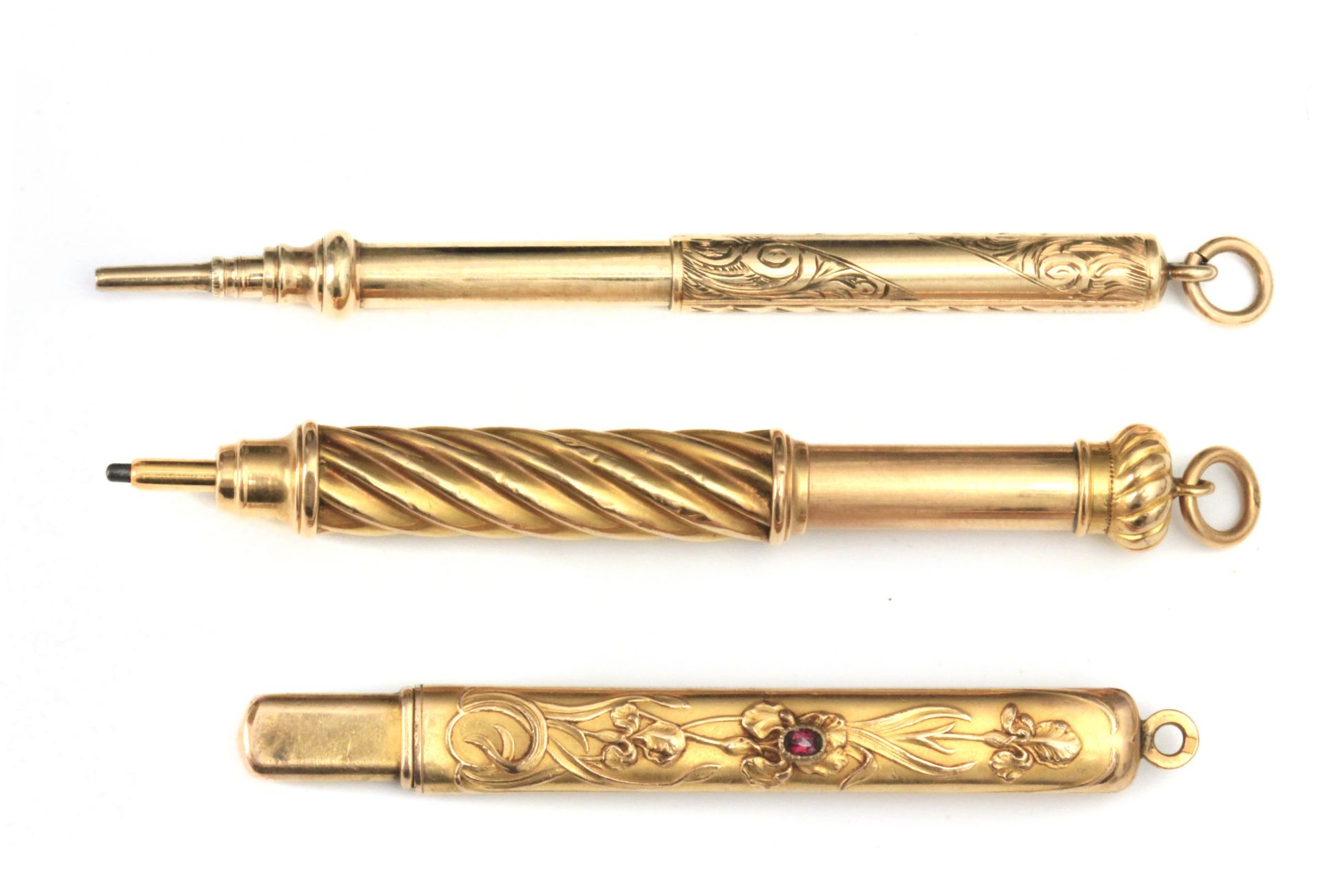 Late 19th century-early 20th century three gold pendant pencil holders