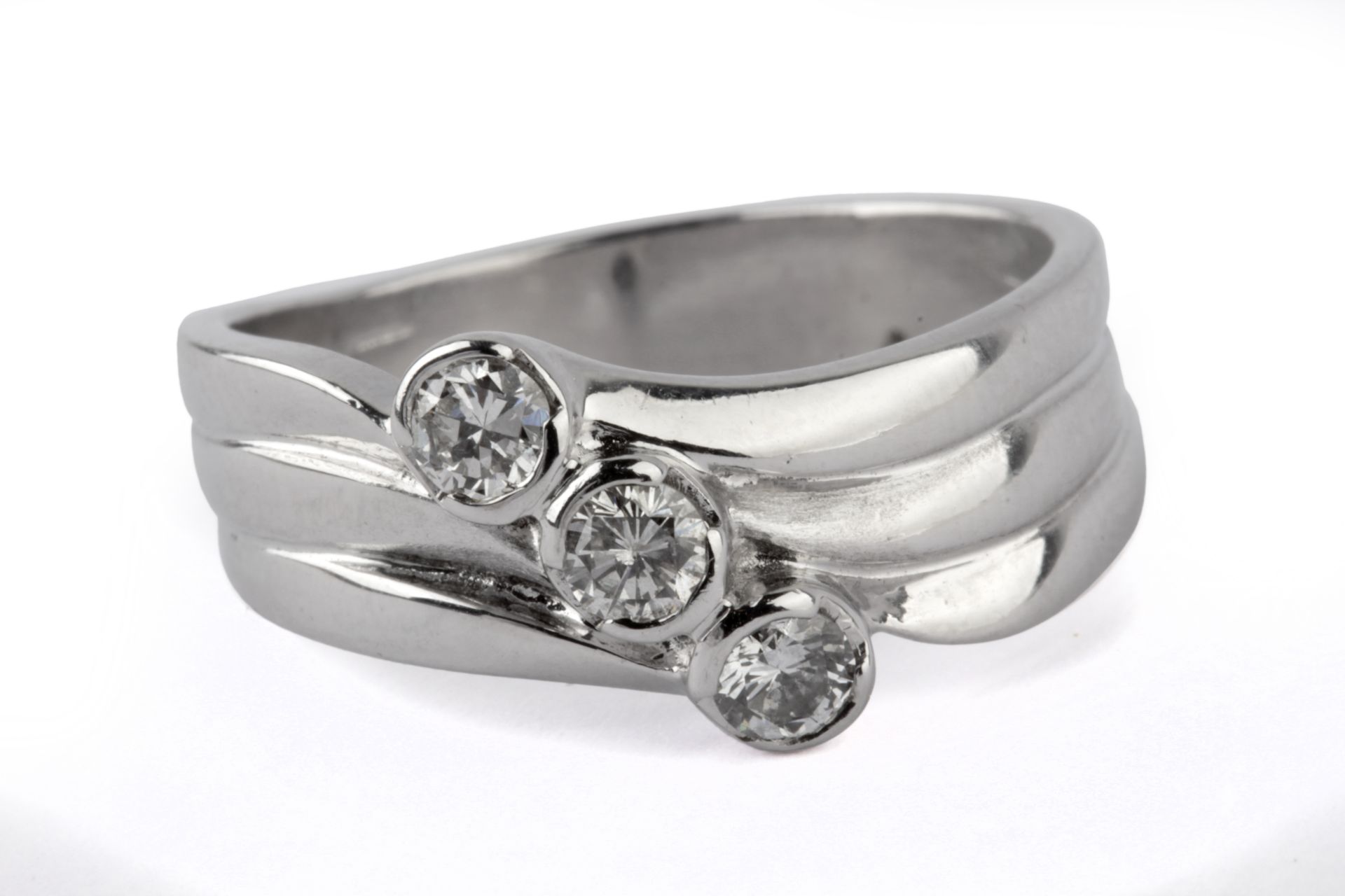 A three stone diamond ring with an 18 k. white gold setting - Image 2 of 2