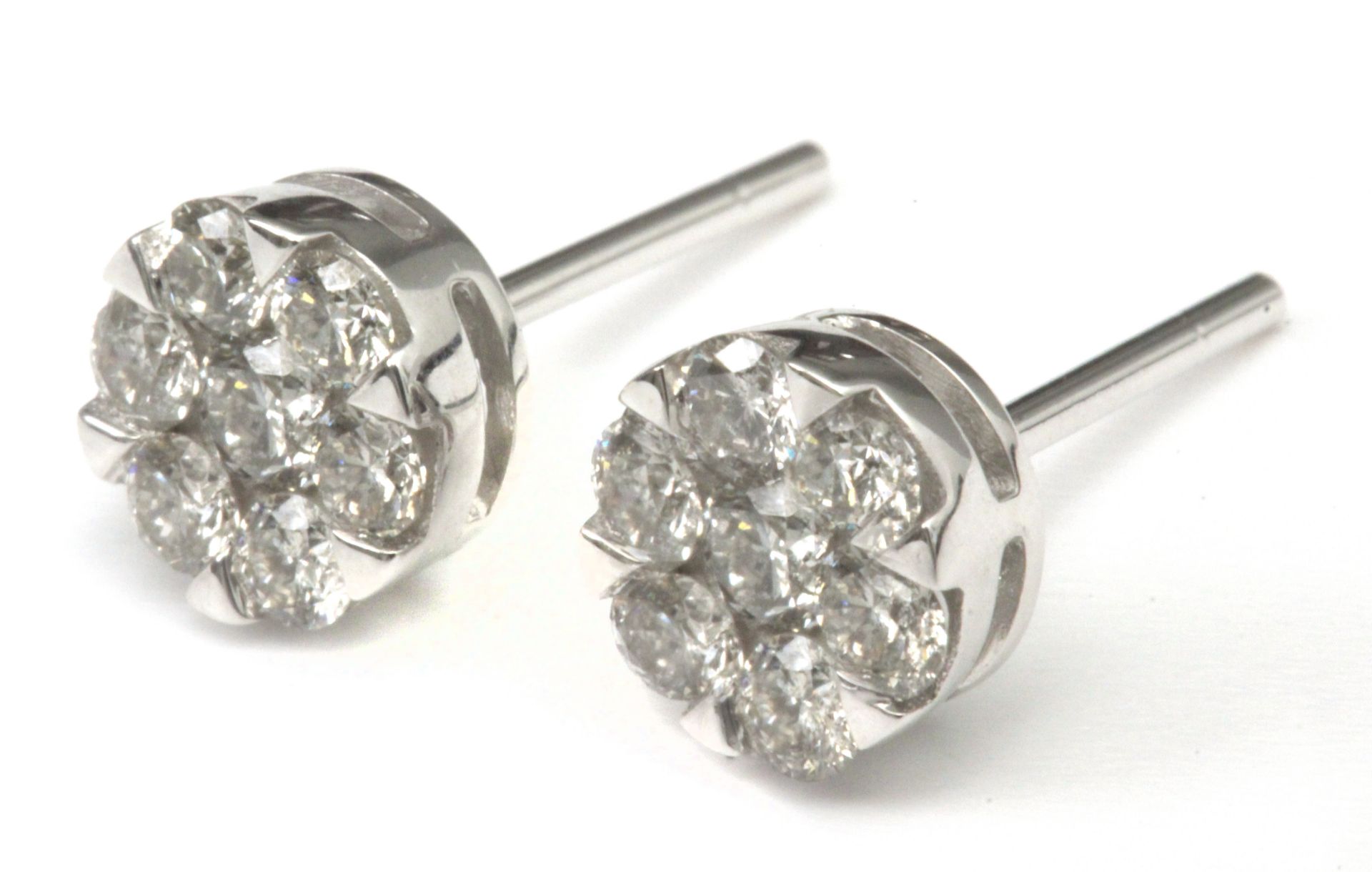 A pair of diamond cluster earrings with an 18 k. white gold setting