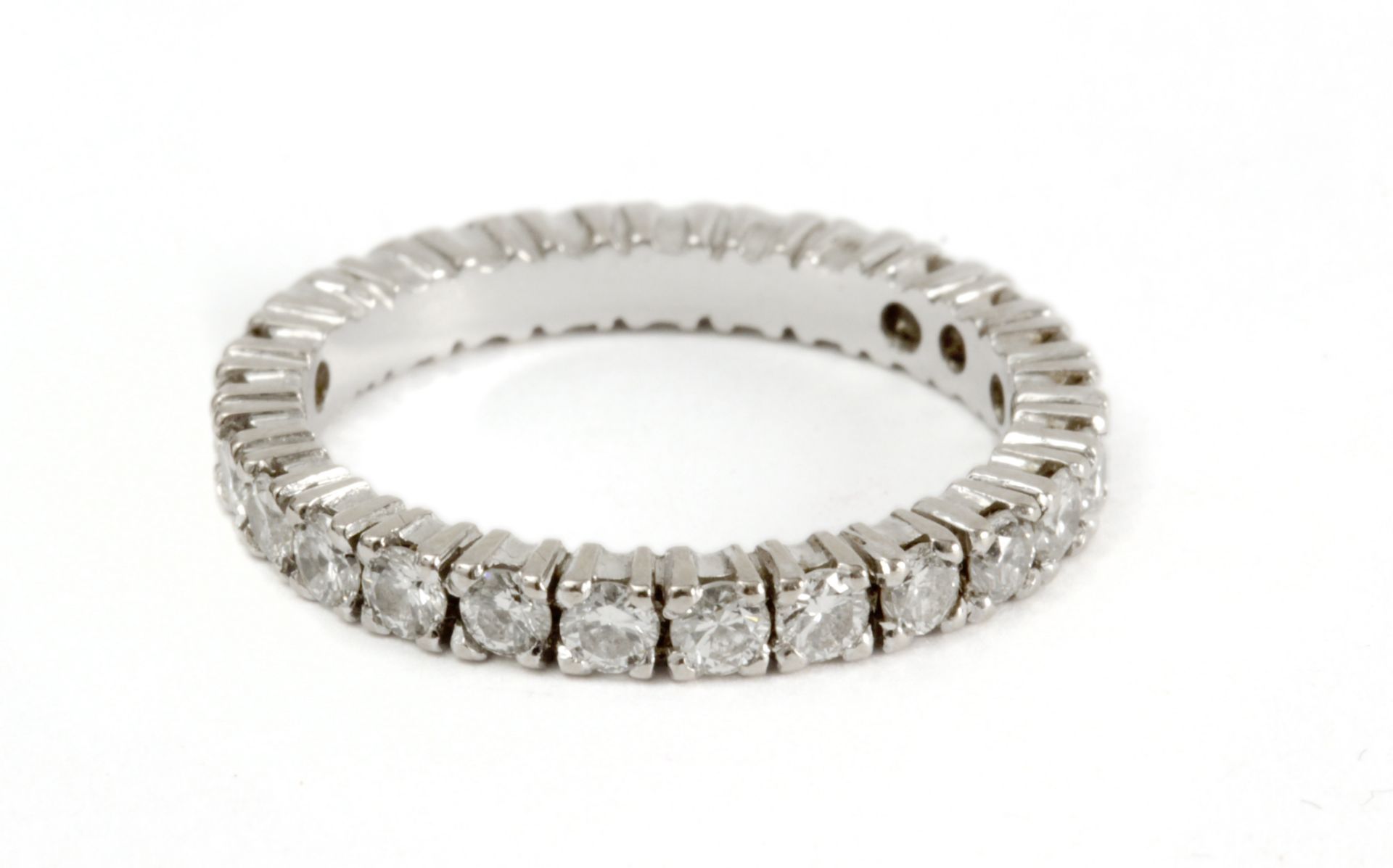 A brilliant cut diamonds eternity ring with an 18 k. white gold setting