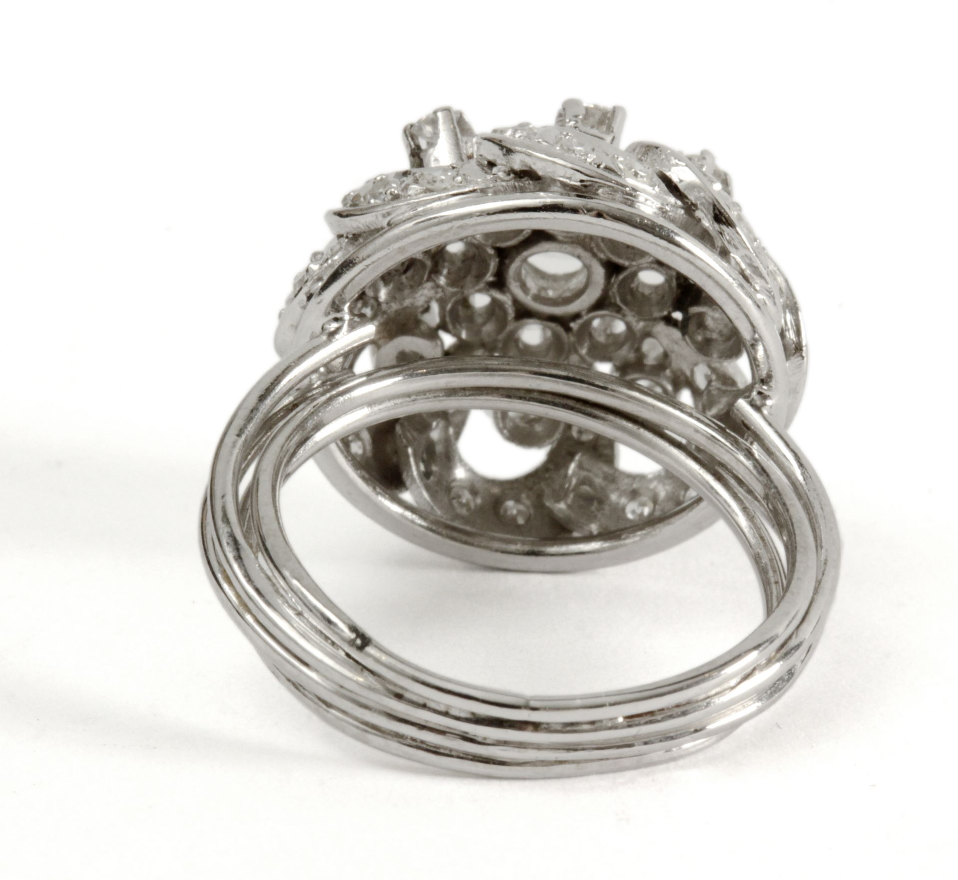 A brilliant cut diamonds bombe ring circa 1950 with a platinum setting - Image 3 of 3