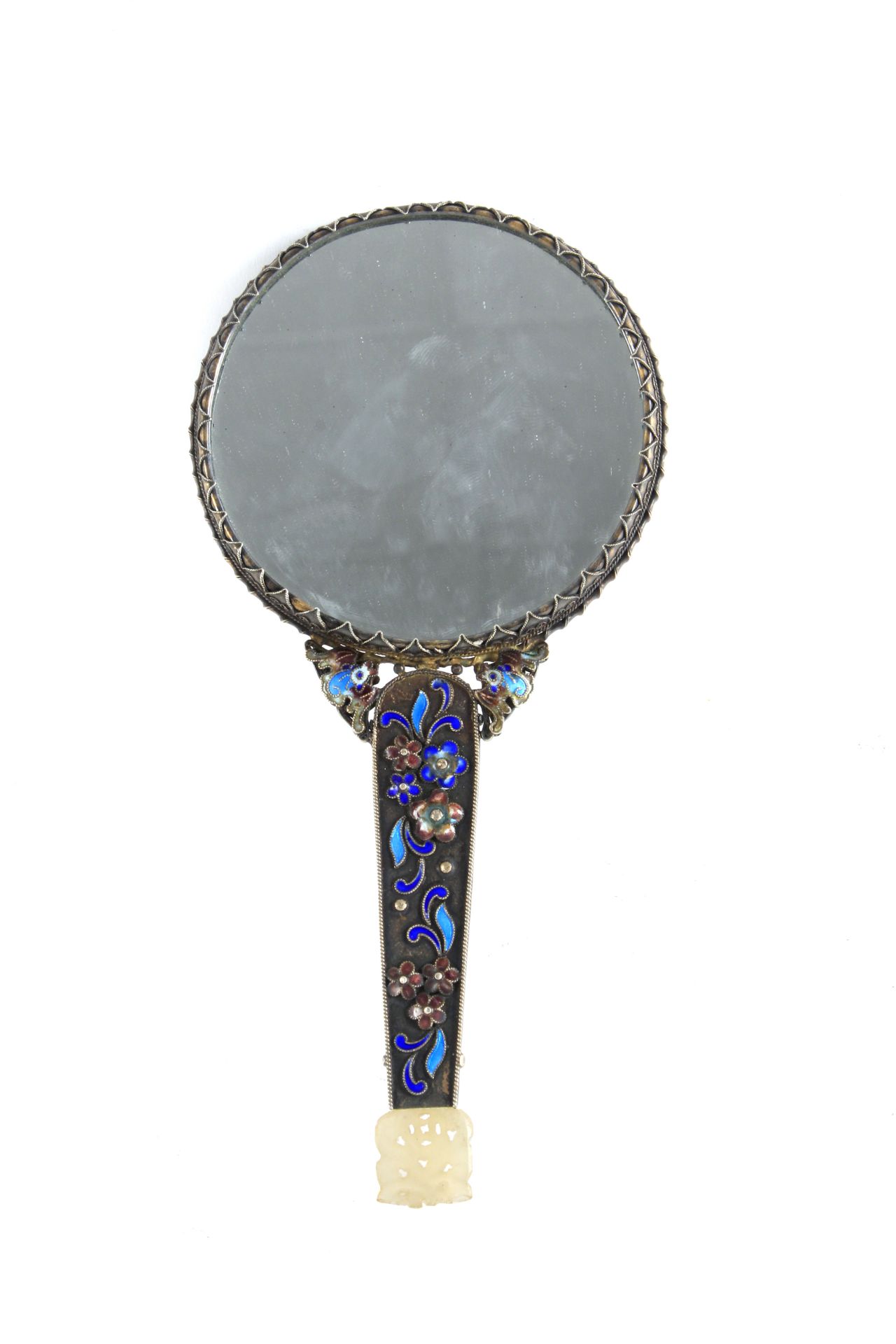 A Chinese silver filigree mirror circa 1950 with embossed jade medallions and enamels