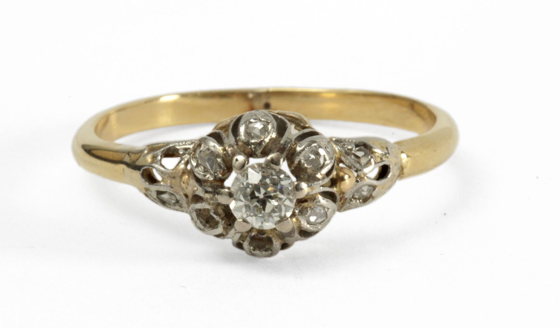 A first half of 20th century diamond ring with an 18 k. yellow gold setting
