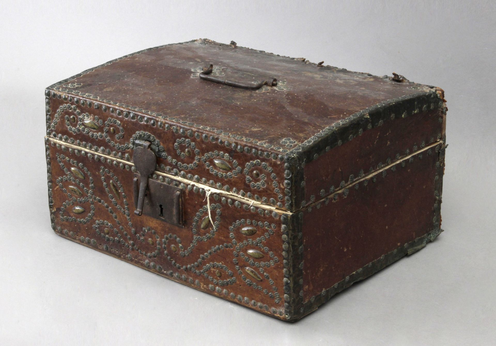 A 17th century French casket in carved wood and embossed leather