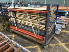 Mobile Steel Framed Stock Rack, with contents including racking uprights and cross beams
