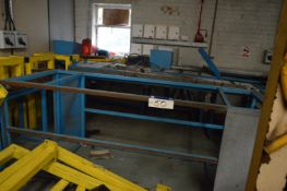 Roller Conveyor, Fabricated Steel Stands & Equipment, in corner of room
