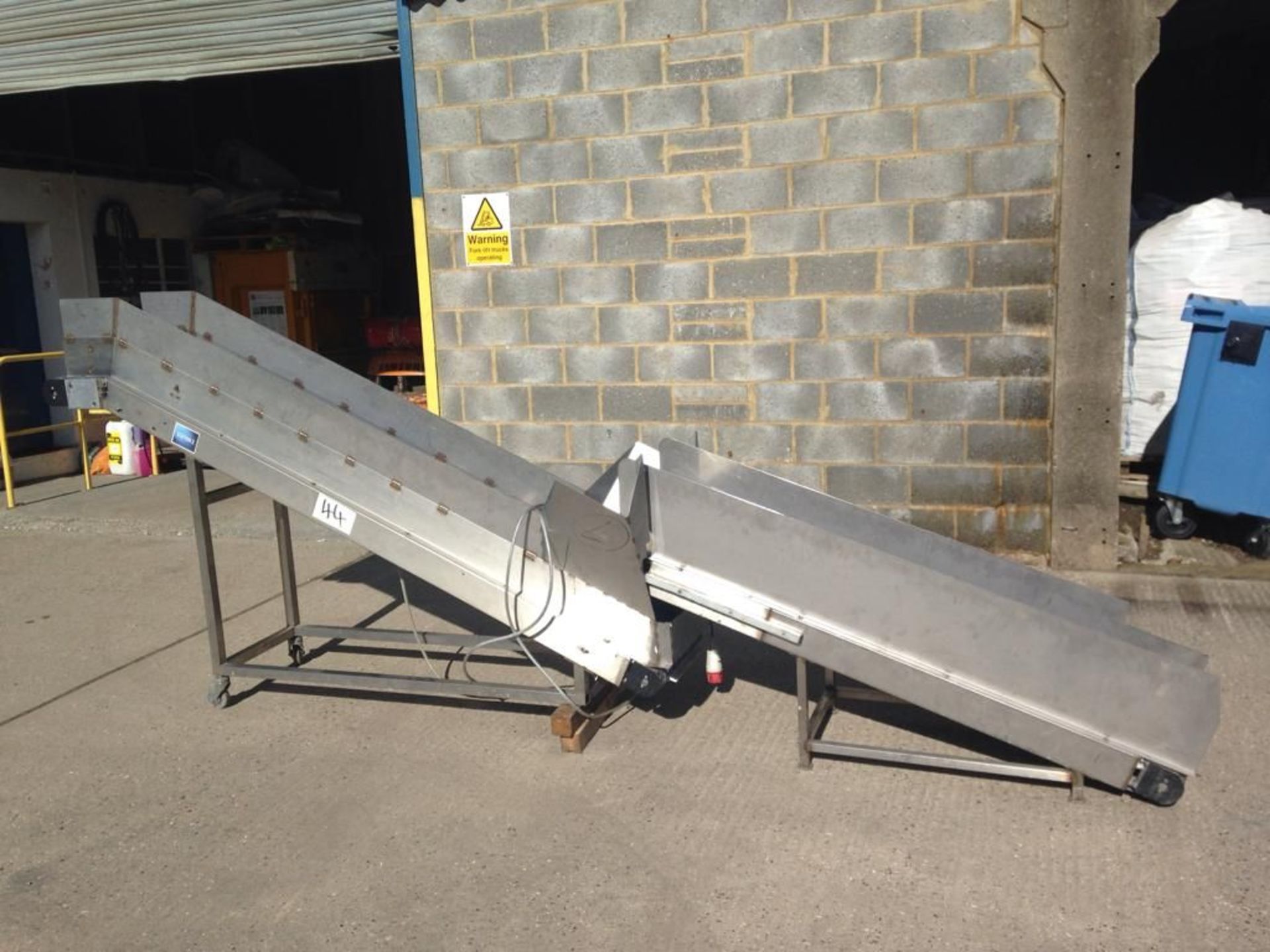 Two Stainless Steel Framed Inclined Interlinked Belt Conveyors, conveyor one 400mm x 1.7m centres