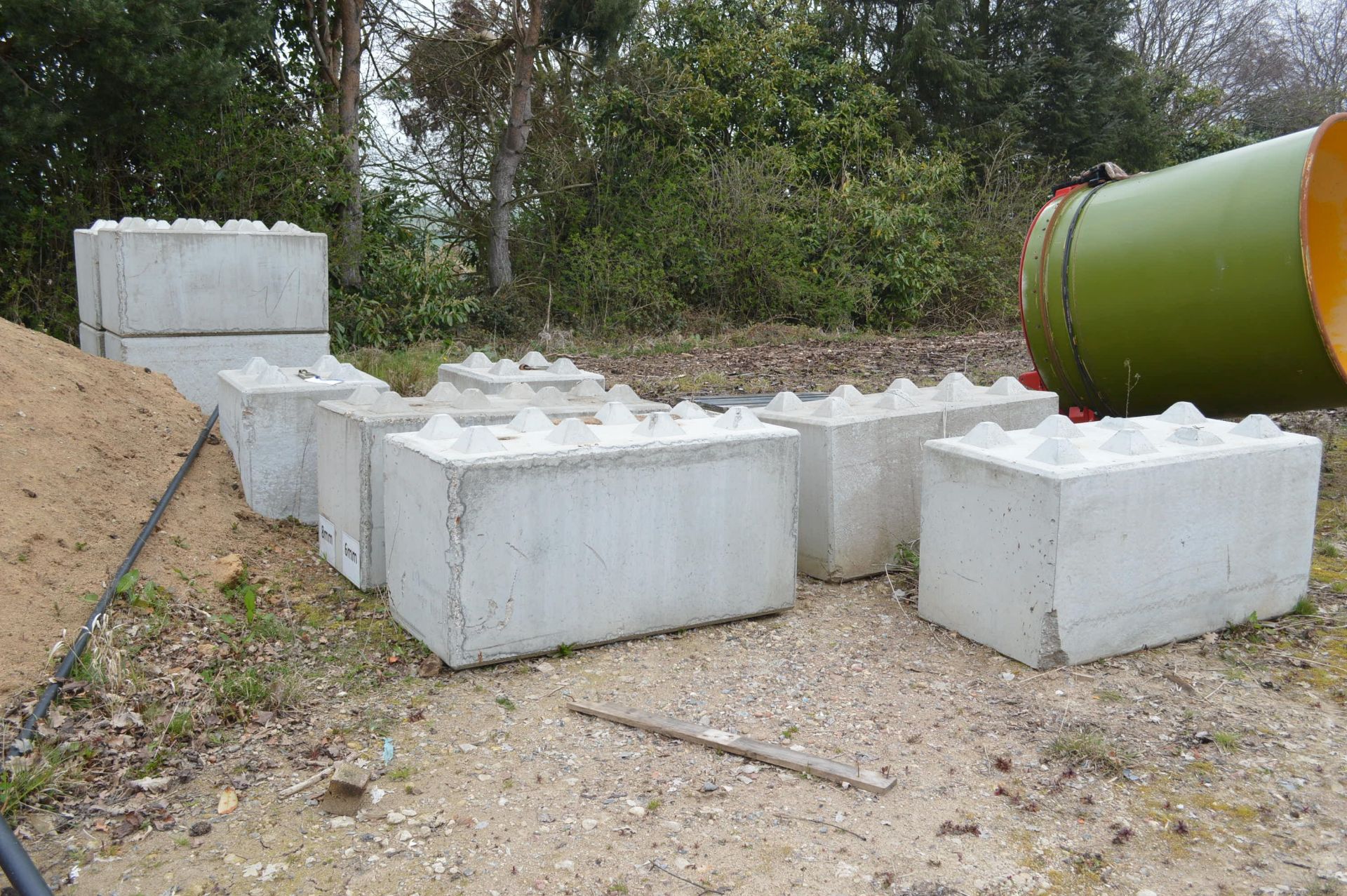 TEN PRE-CAST CONCRETE INTERLOCKING BLOCKS, comprising eight each approx. 1.6m x 800mm x 800mm and