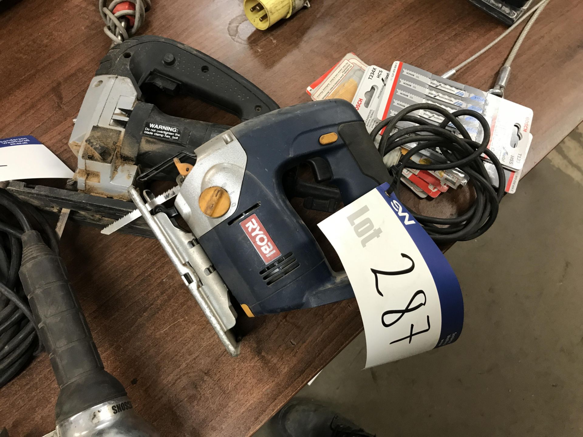 Two Electric Jig Saws, 110V, one battery, with cutting blades (lot located at Bedfords Limited (In