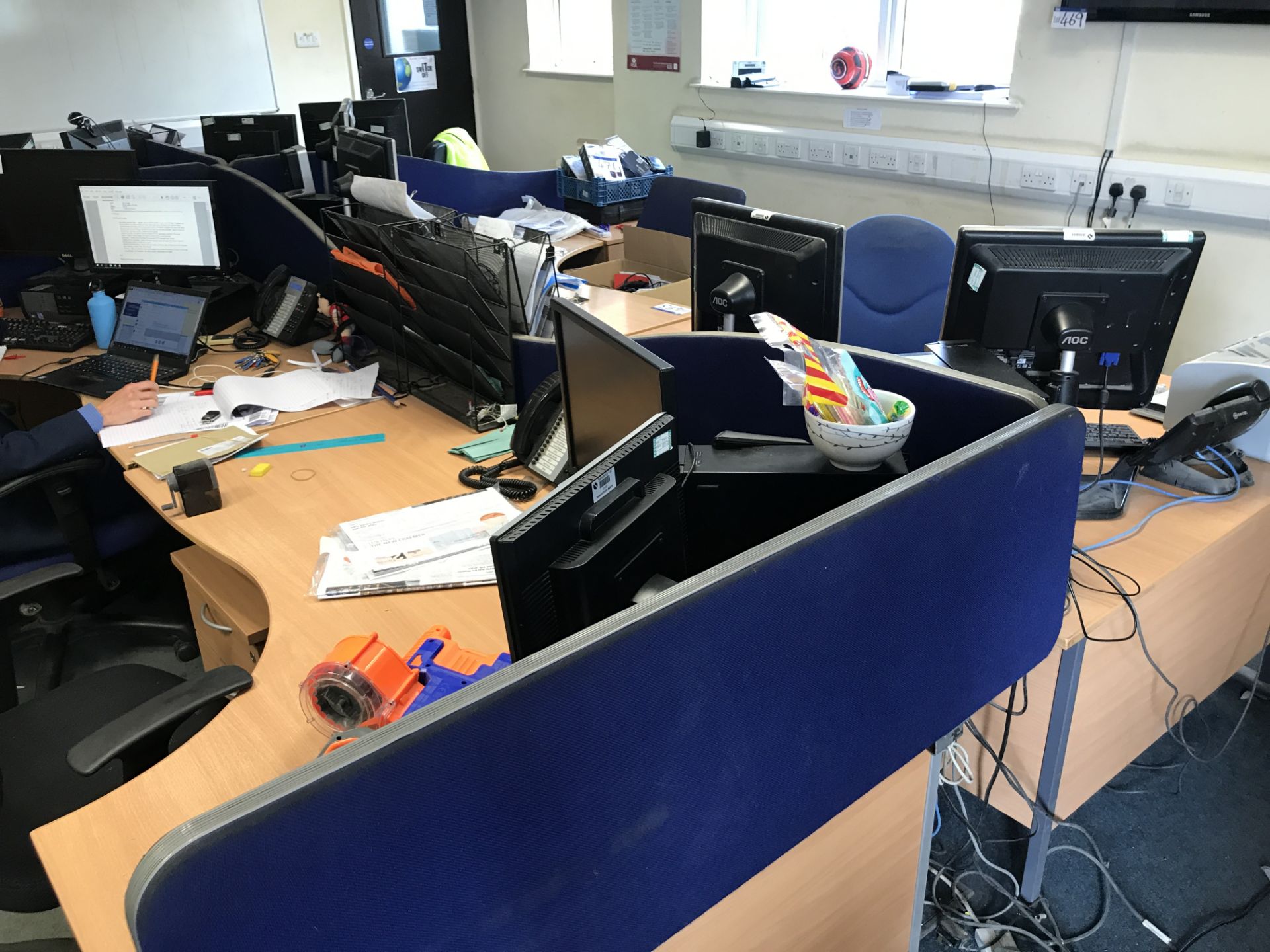 Island of Desks, comprising six curved front cantilever framed desks, four desk pedestals, six