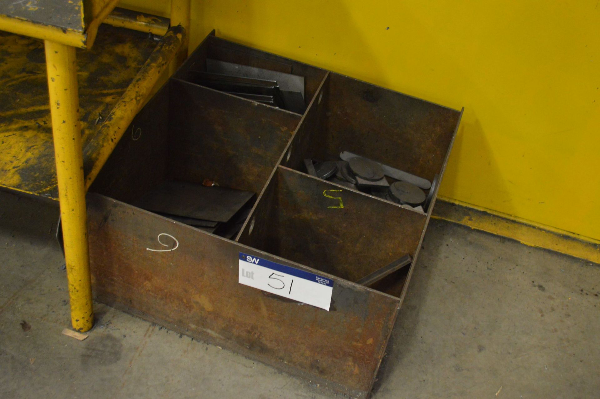 Fabricated Steel Four Compartment Bin, with contents including steel packers