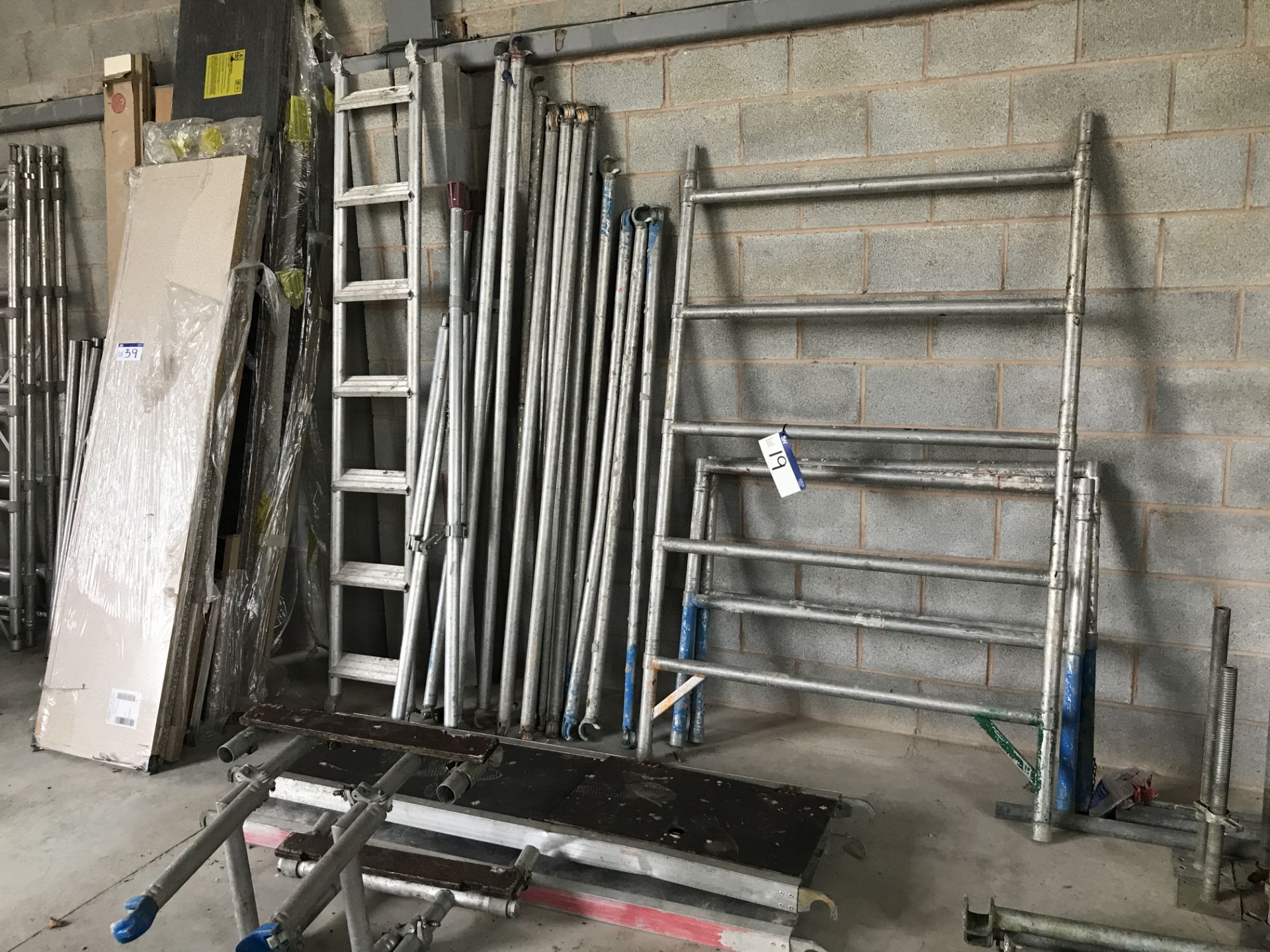 Scaffolding Components, as set out against wall