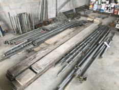 Scaffolding Components, as set out on floor, against wall and on pallet