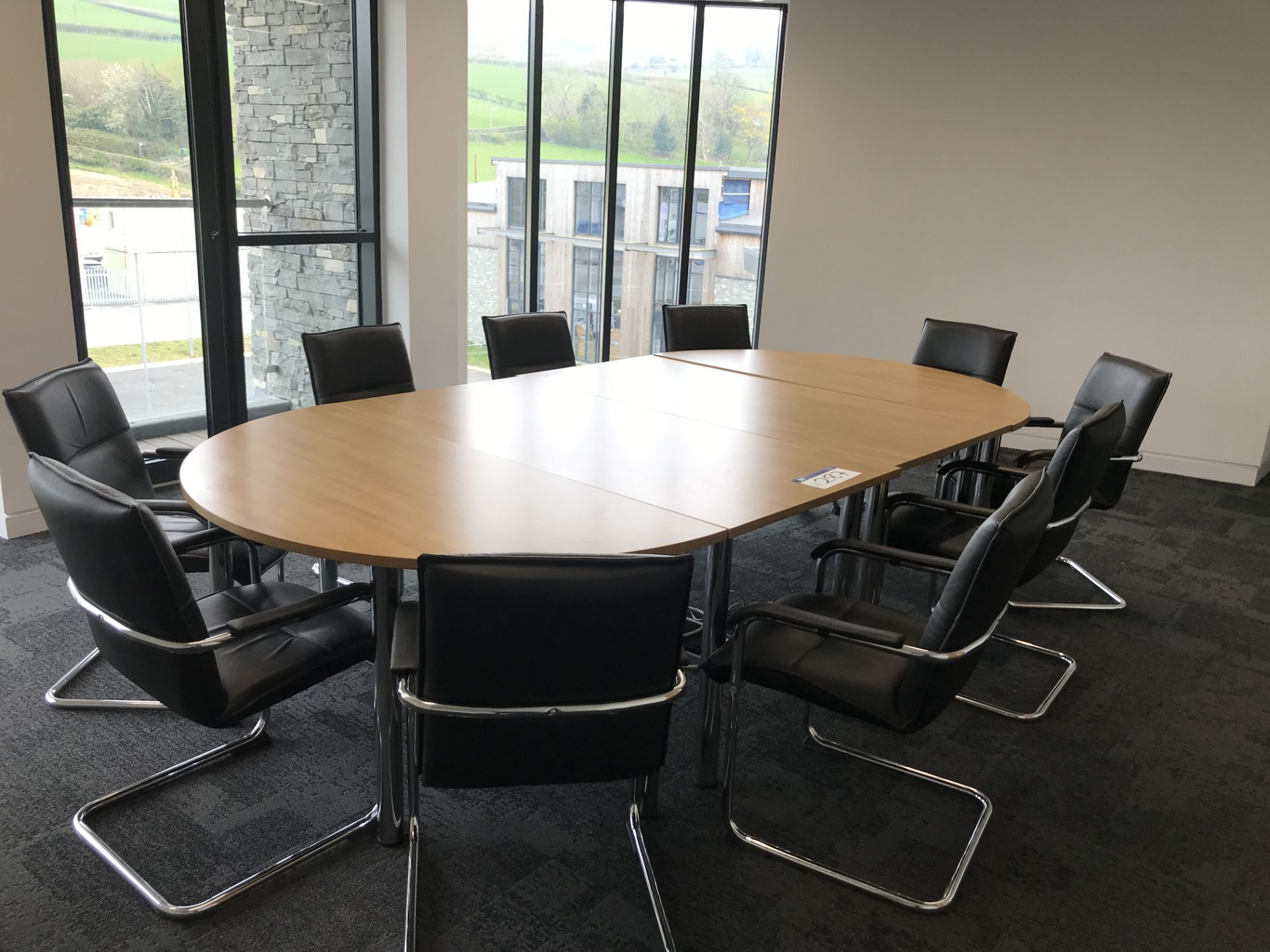 Four Section Curved Boardroom Table, approx. 3.2m x 1.6m, with ten leather effect upholstered