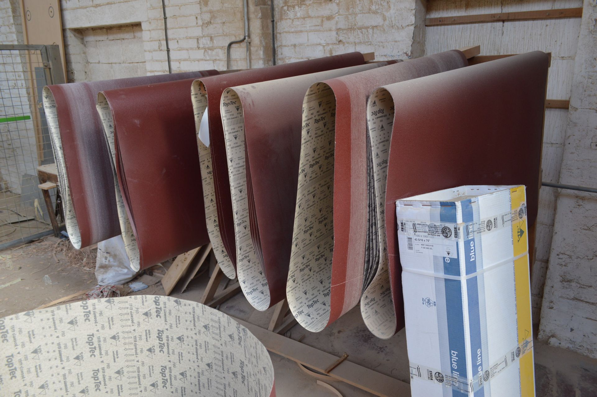 Assorted 1100mm wide Sanding Belts, with timber rack and in box - Image 2 of 2