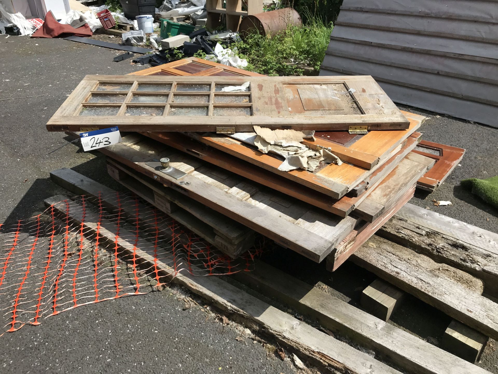 Assorted Wood Doors & Pallets, as set out in two stacks