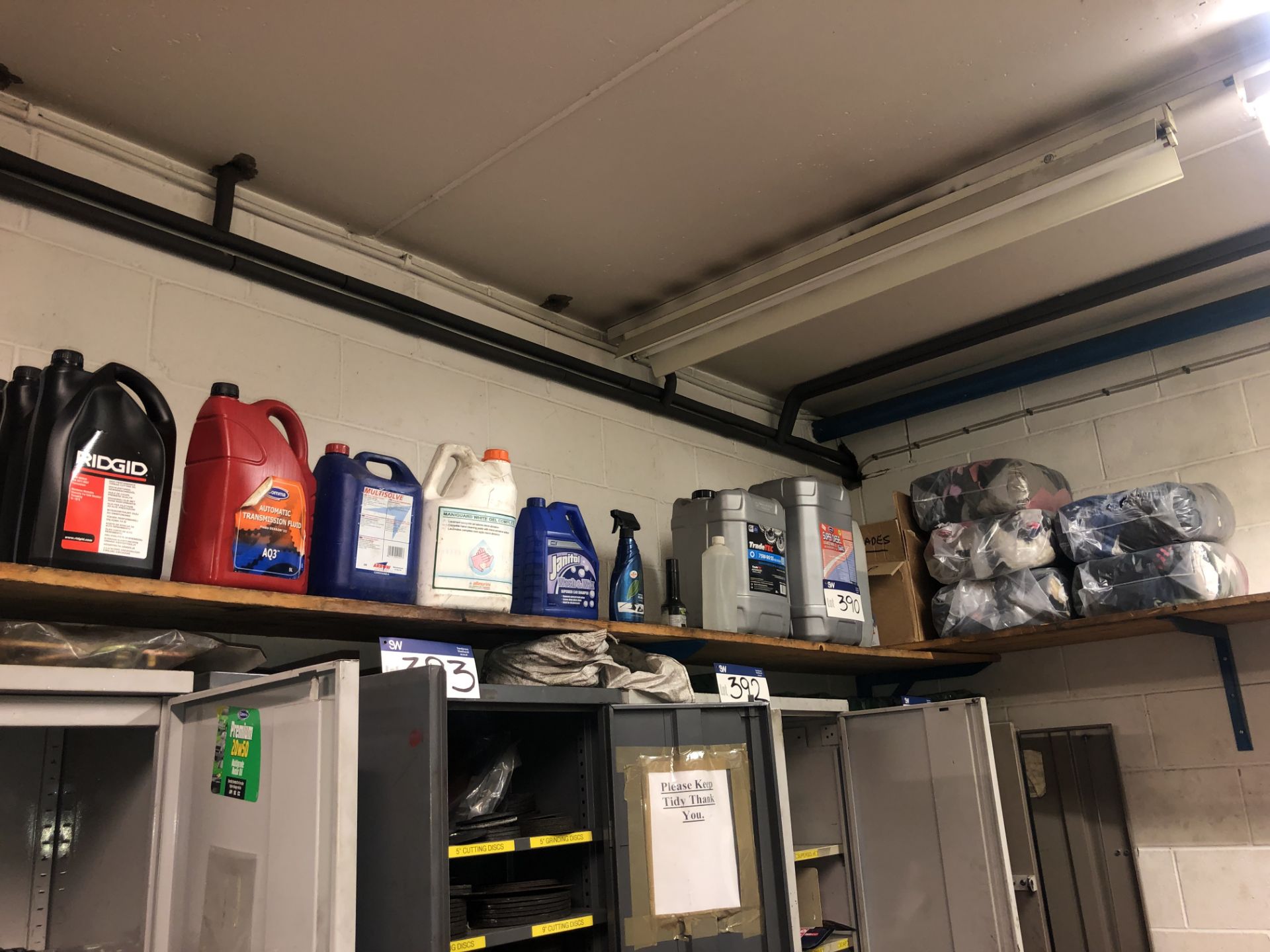 Quantity of Lubricants & Fluids, as set out on shelf above cabinet