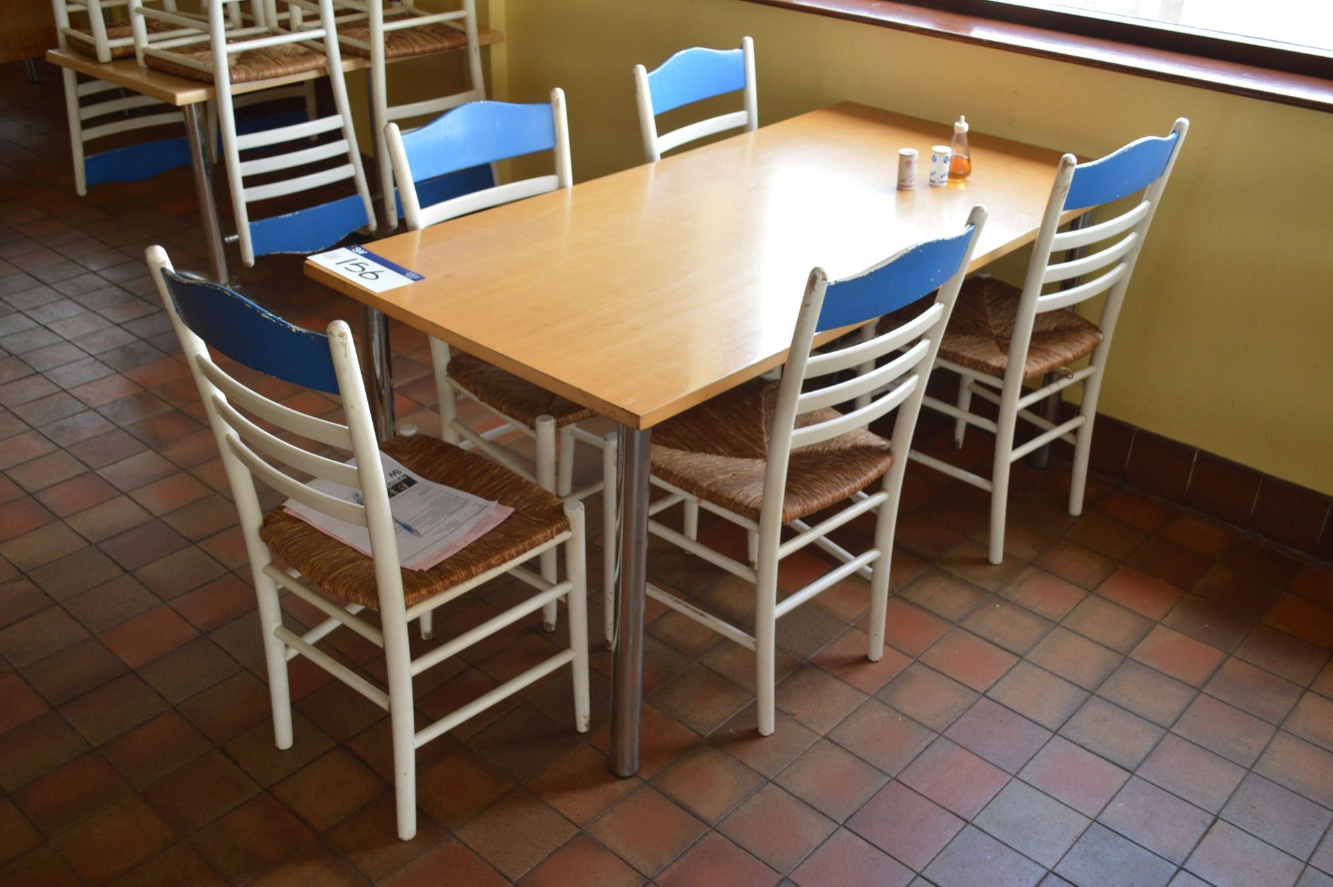 Two Steel Framed Canteen Tables, with nine wood framed stand chairs