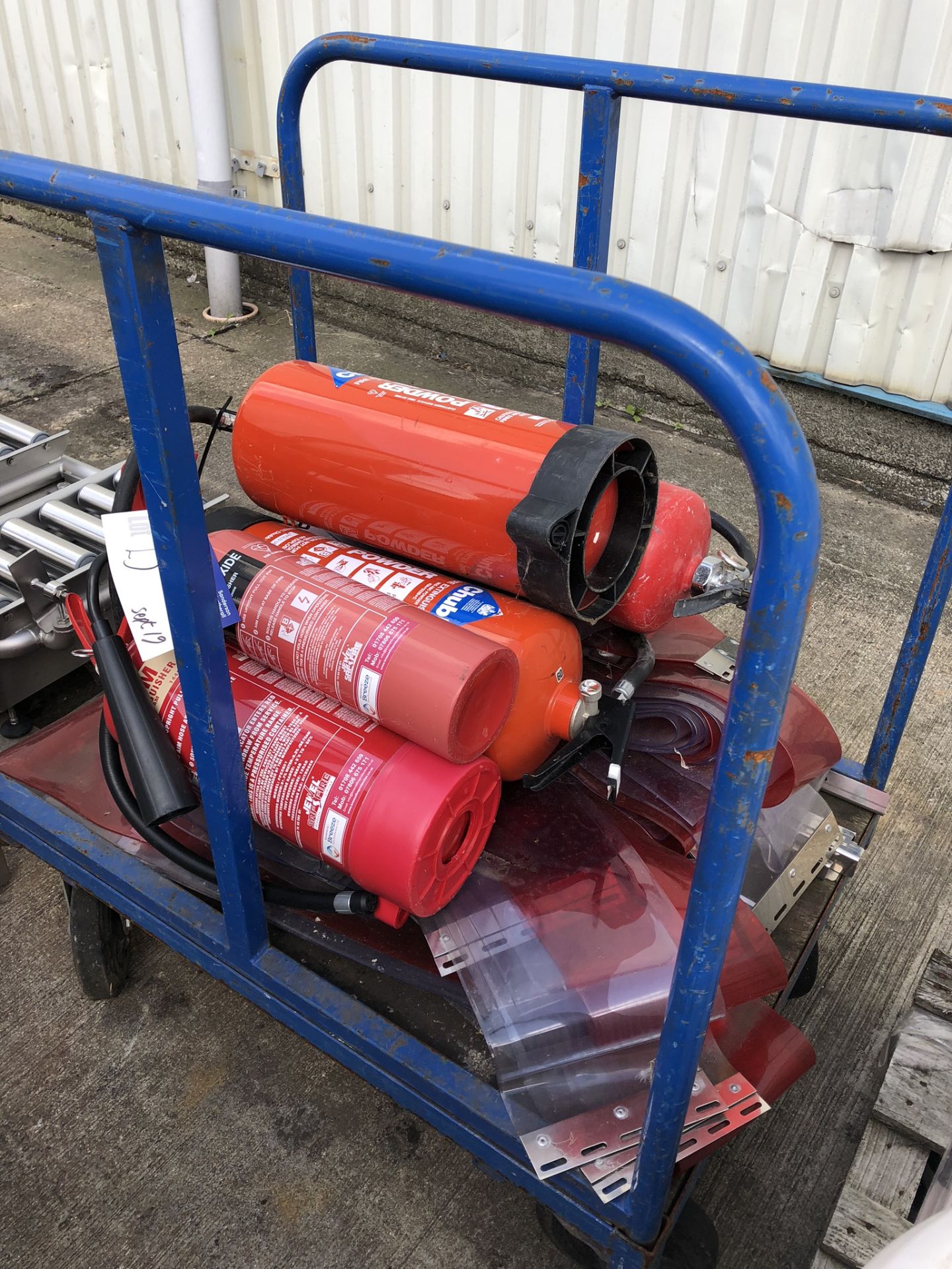 Trolley, with five fire extinguishers and plastic curtain, lift out charge - £20 - Image 2 of 2