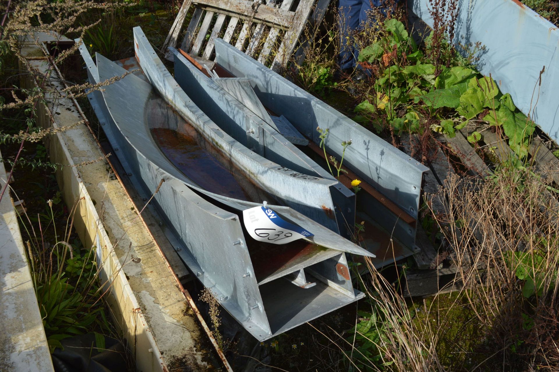 Two Galvanised Steel Cased approx. 250mm wide Chain & Flight Conveyor Sections (one radius)