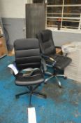 Two Leather Effect Upholstered Swivel Armchairs