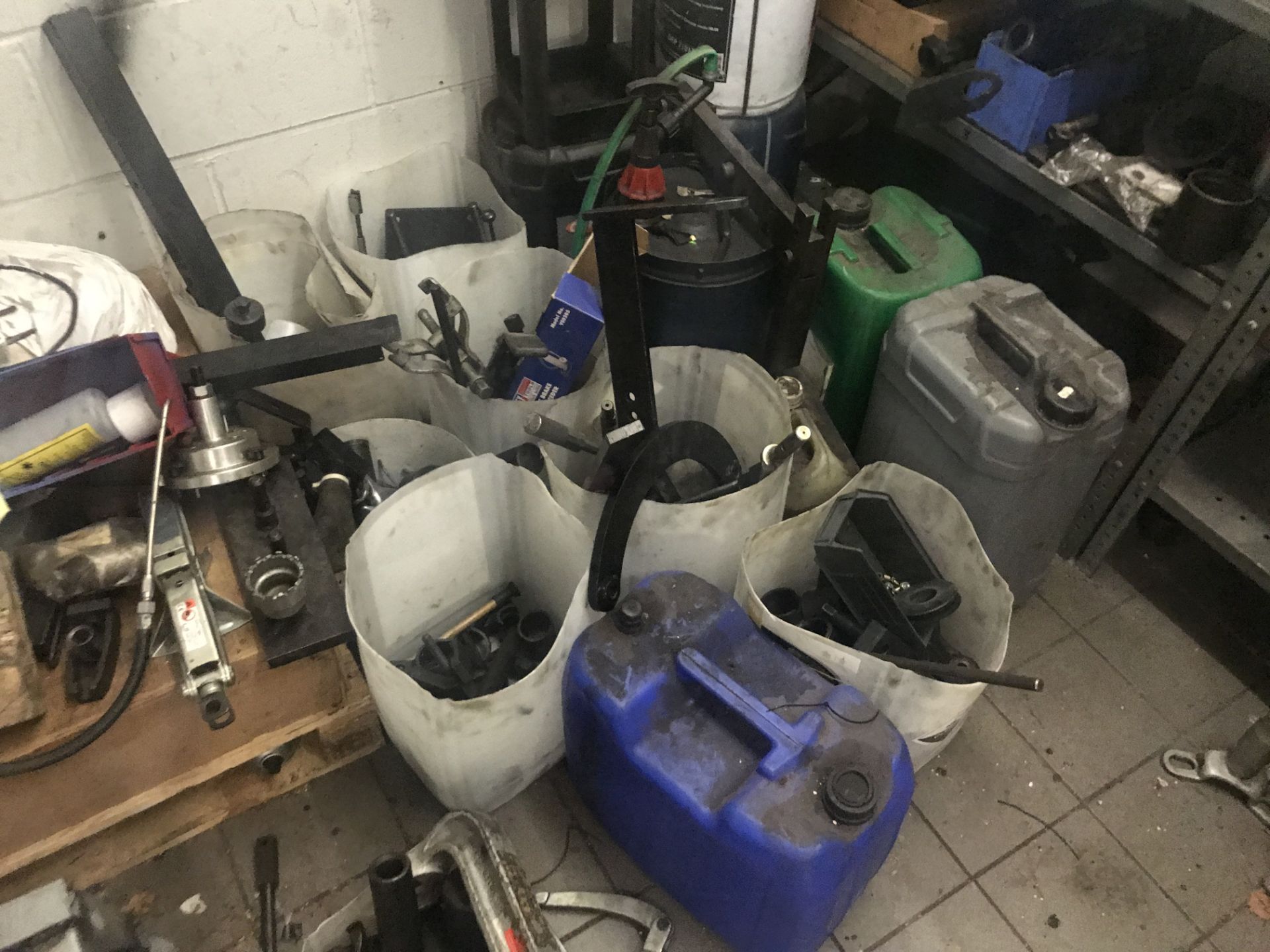 Contents of Store Room, including lubricants, plastic canisters, stock rack, trolley and vehicle - Image 4 of 5