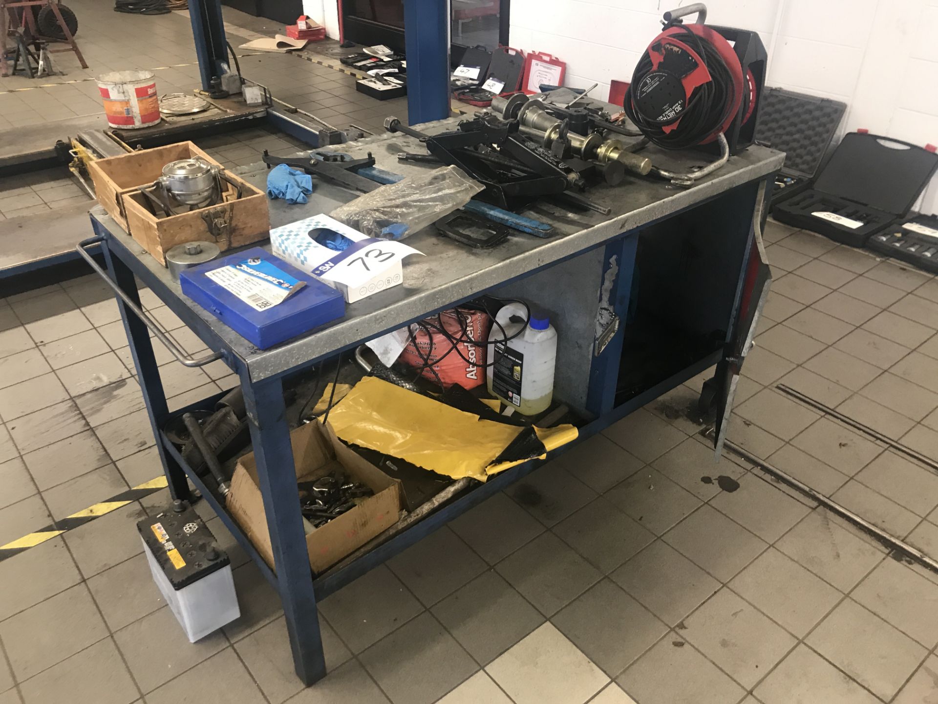 Steel Framed Mobile Workbench, with contents as set out including two extension reels and car jack