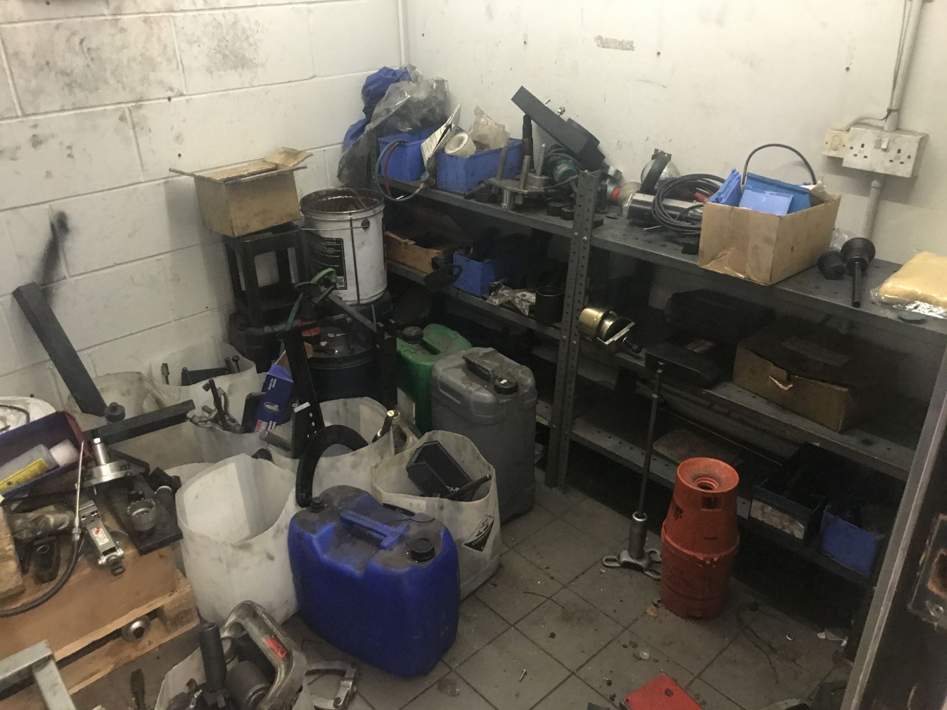 Contents of Store Room, including lubricants, plastic canisters, stock rack, trolley and vehicle