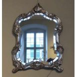 Spiegel mit Silberrahmen19. Jh., im Rokoko-StilAllseitig geschweift mit hochgetriebenen Rocaillen