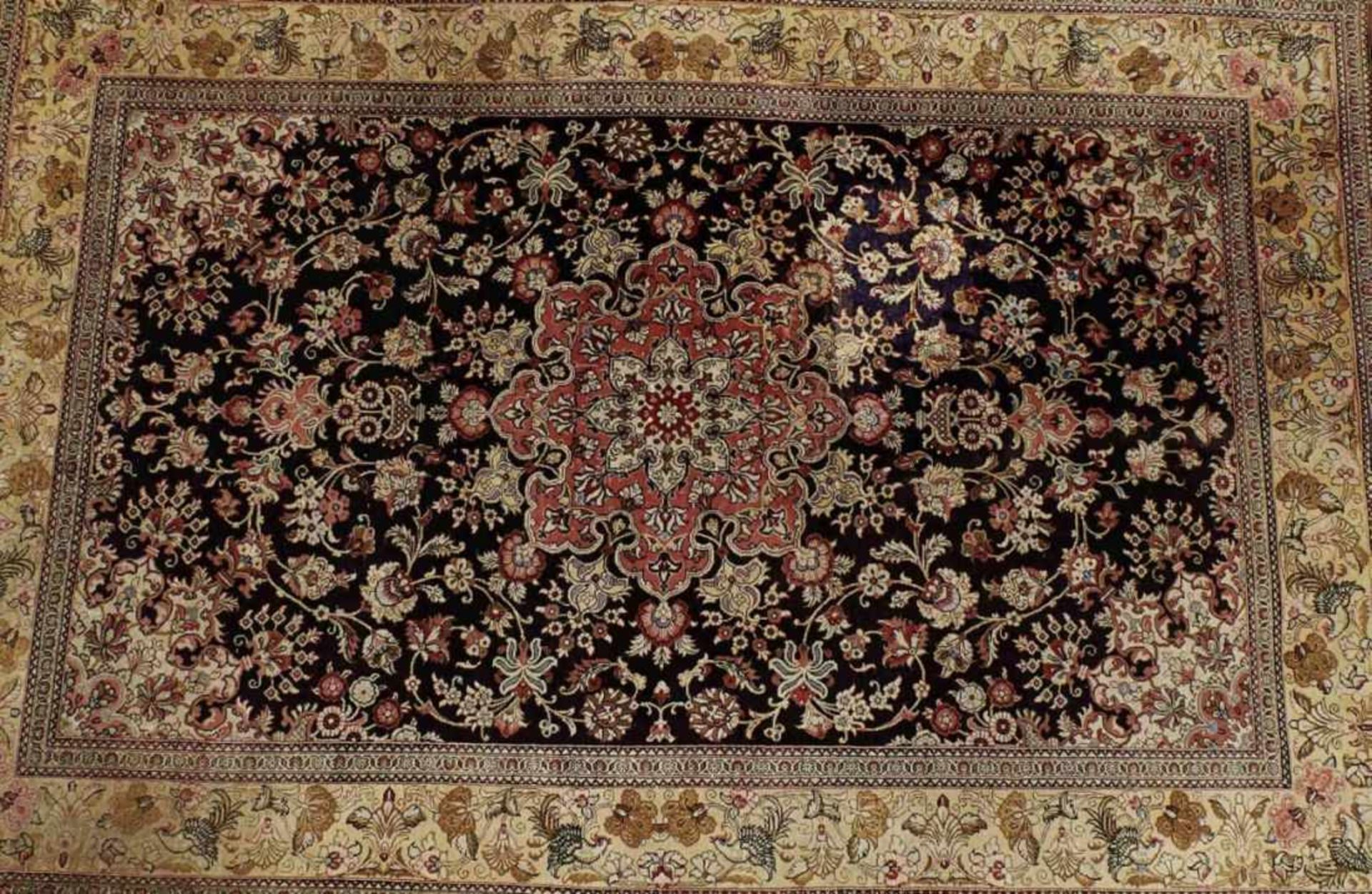 GhomIran, 20th c.Beige ground border with fine palmette frieze and birds, brown ground centre