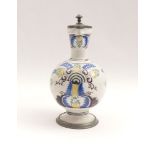 JugHanau, 18th cent.White glazed faience painted in color, pewter mounting. Big carved mark ''C'' on