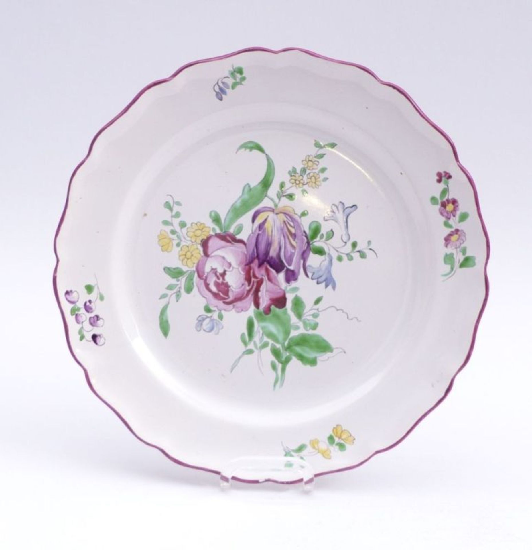 Flower plateStrasbourg, 19th c.Small, round form with multiple curved ''Baroque'' edge; large flower