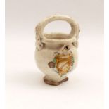 Syrup JugItaly, 17th cent.White glazed maiolica with colored painting. H. 17 cm. - handle with