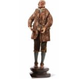 Neapolitan crib figure - ShepherdAround 1800An elderly man standing on a profiled pedestal in a